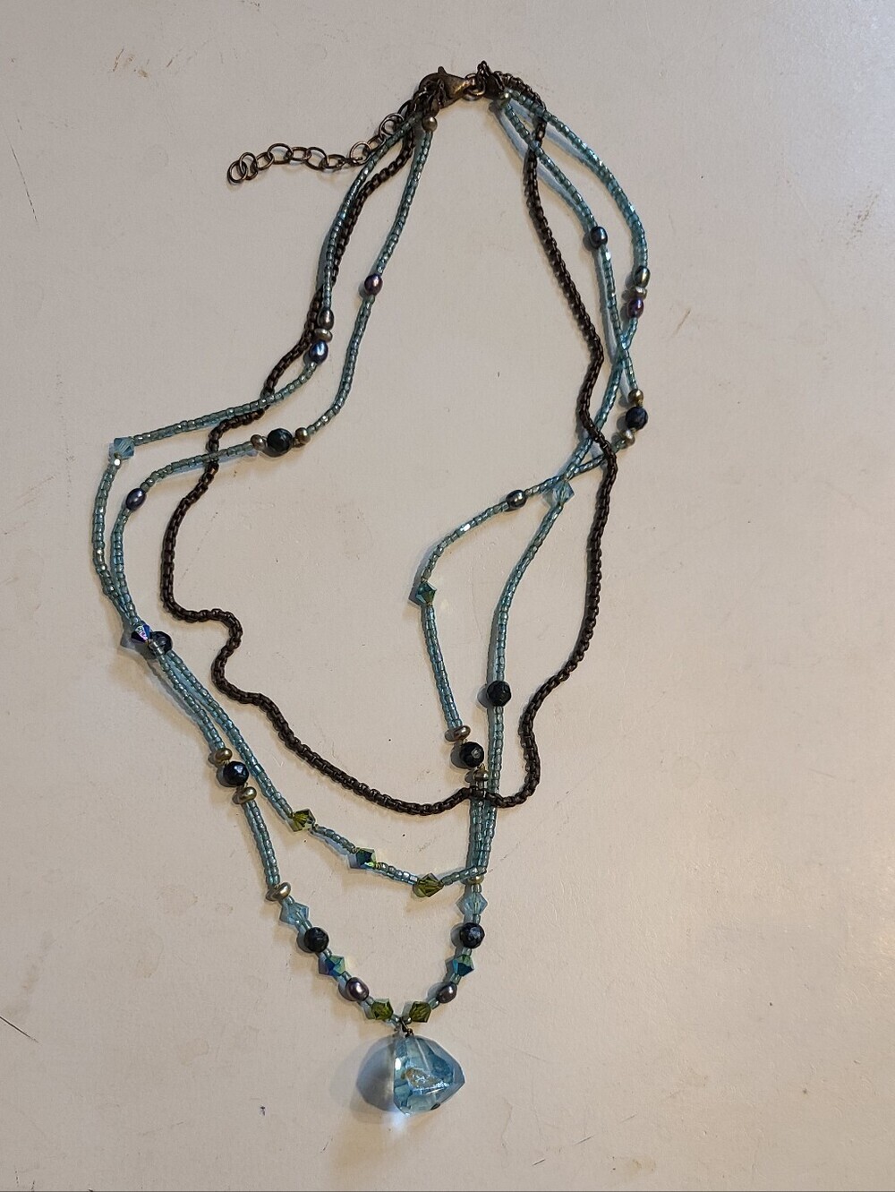 Beaded Multi-Strand Blue And Turquoise Pendant Necklace